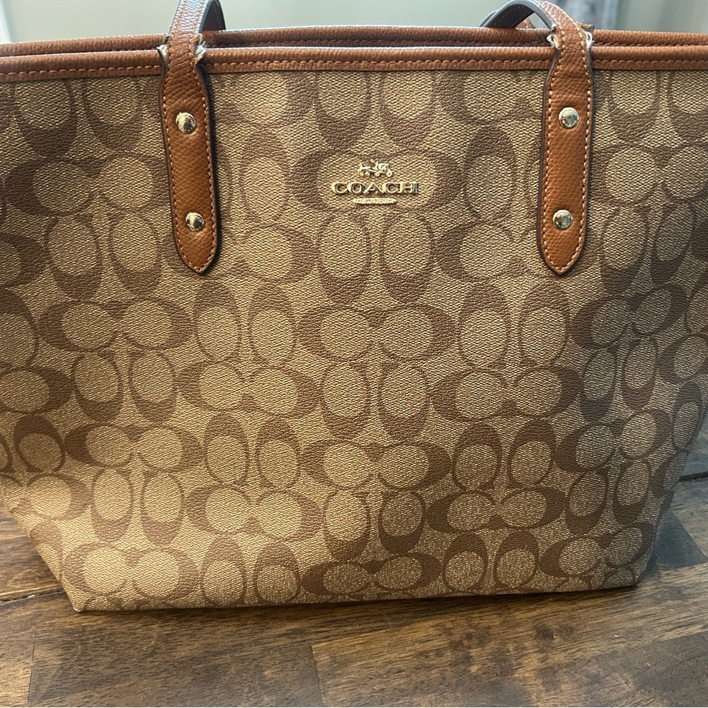 Coach Brown Signature Tote Bag with Leather Trim  15” wide. 10” long. Nonsmoking